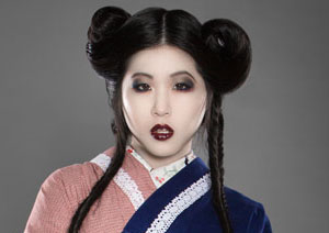 Young woman in red, white and blue kimono